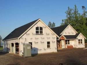 Another view of a Spane Buildings post frame home being built in Puyallup WA